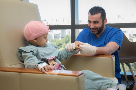 Child receiving treatment for cancer
