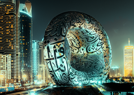 a large sculpture of an abstract egg shaped design on a bridge in Dubai